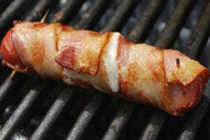 Bacon wrapped cheese hot dogs